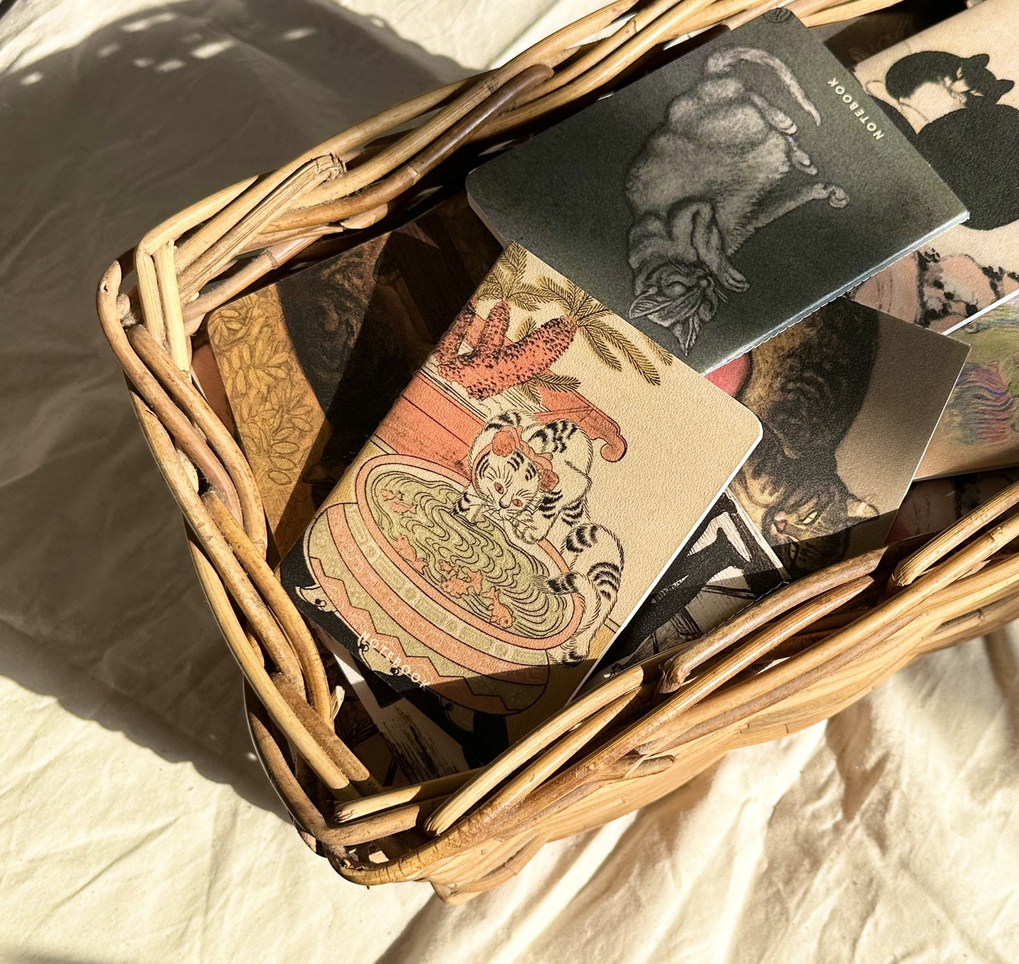 Malabar Press notebooks in a basket